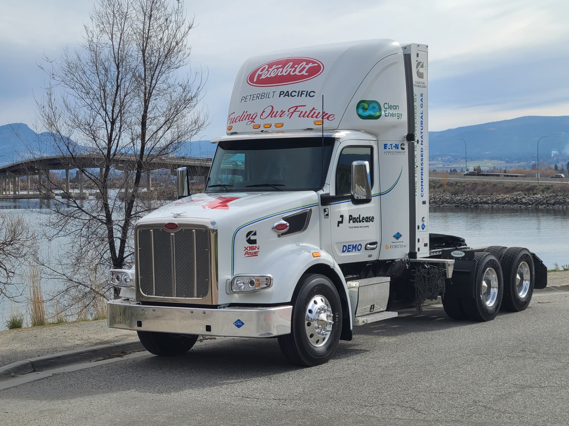 Peterbilt 567 CNG demonstration truck in Peterbilt Pacific white, parked by the Okanagan waterfront
